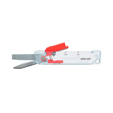 A Hako-Ake multi-tool pocket knife with a clear plastic case, red metal lever, and silver blades, shown against a plain white background.