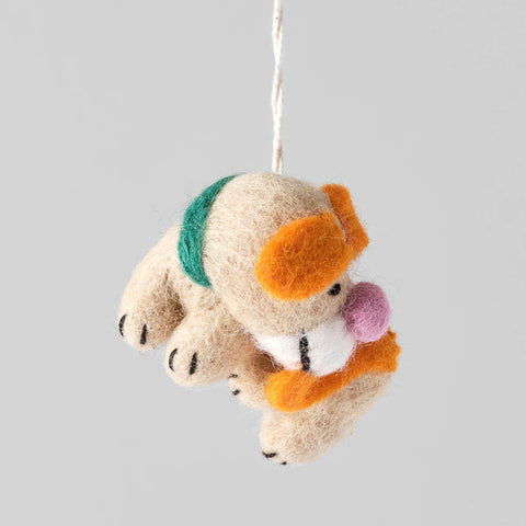 Ornament perro Bingo persiguiéndose la cola