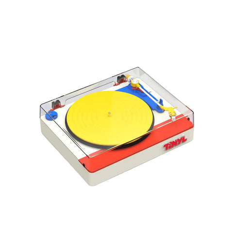 Small model of a turntable with a yellow record on a white background