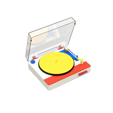 Model turntable with a yellow platter and red base on a white background