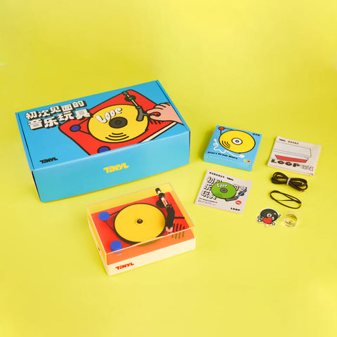 Toy packaging with colorful design elements on a yellow background
