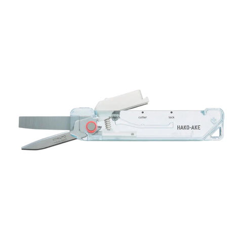 A HAKKO multi-tool pocket knife with a transparent plastic body, silver metal blades, and a small red button, shown against a plain white background.