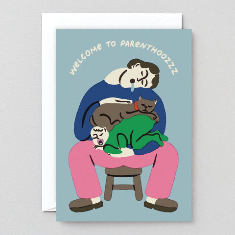 Greeting card with an illustration of a person sitting on a stool with three cats, text 'Welcome to Parenthoozzz', on a light blue background.