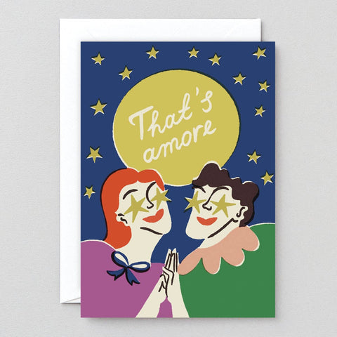 Greeting card with two people under a moon and stars, featuring the text 'That's amore'.