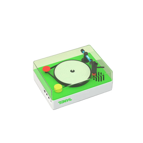 Toy turntable with vinyl record on a gray background